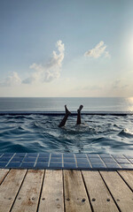 Naklejka premium jump to swimming pool, feet upside down, summer fun activity