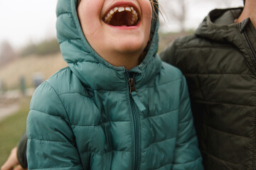 Girl throws her head back and laughs