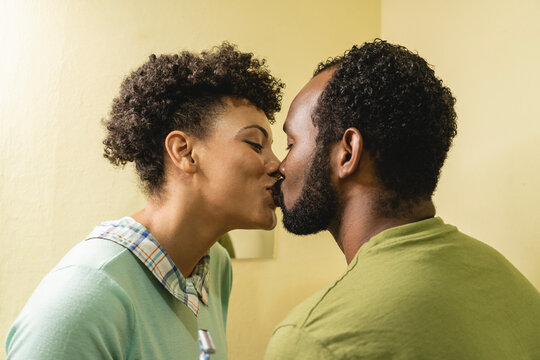African American couple kissing in the bathroom