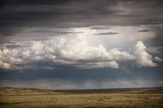 Clouds swirl during a summer rain storm.