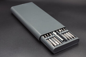 Set of heads for screwdriver bits Tools collection copy space, close up, selective focus. blurred dark background