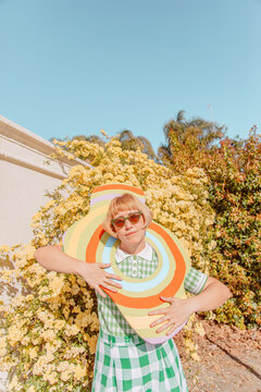 Woman holding colorful object
