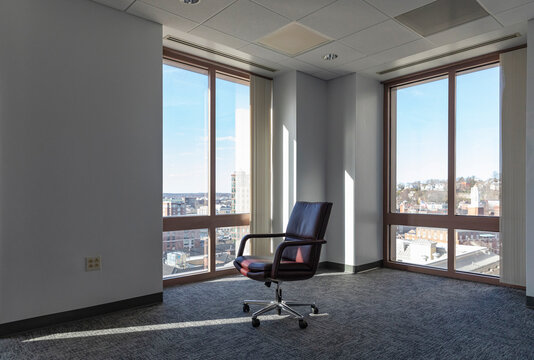 Single Office Chair in Empty Office in Downtown office building