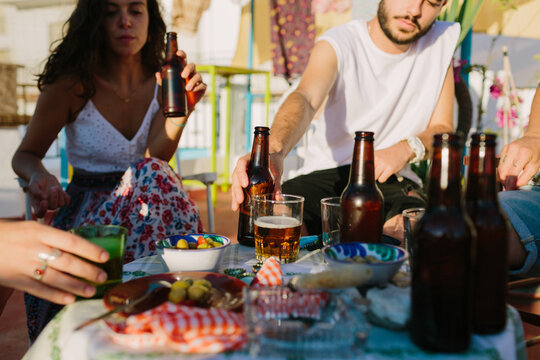 Table with appetizers and people in the background