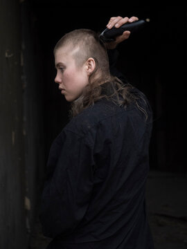 Young girl cuts her head bald