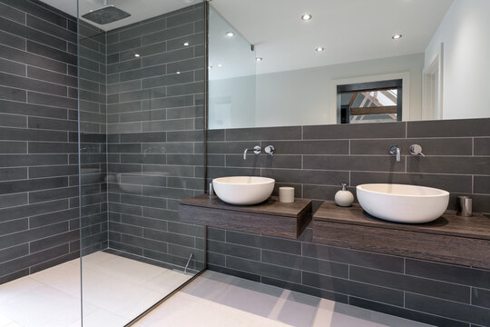 Modern shower room with two basins.