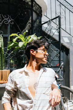 Young Man Relaxing In A Garden