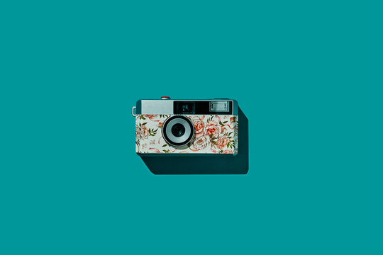floral camera on a blue background