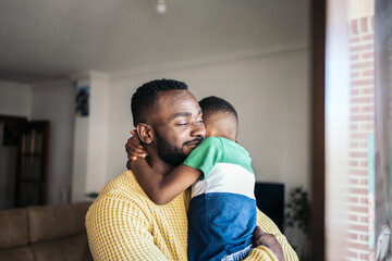 father and son hugging