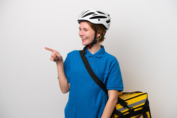 Young English woman with thermal backpack isolated on white background pointing finger to the side and presenting a product