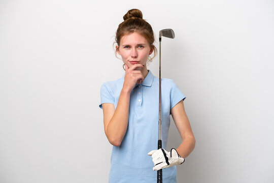 Young English woman playing golf isolated on white background thinking