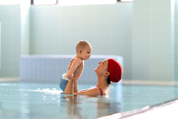idyllic moment between mother and child in the pool