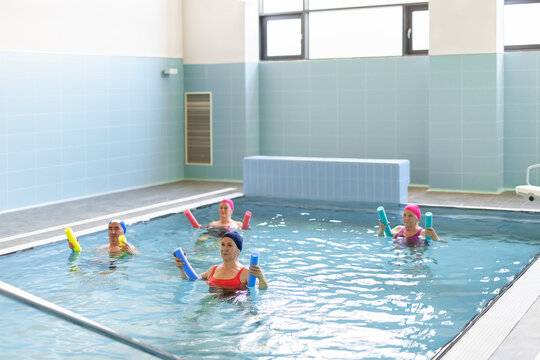 Senior people exercising in pool