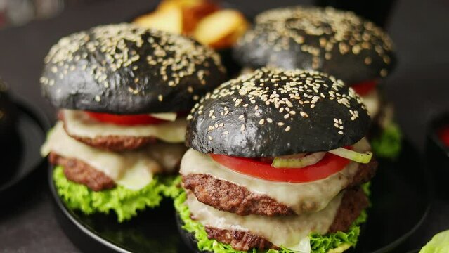 Delicious black hamburger with patties and cheese