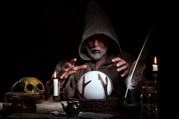 Magician with magic ball with space for product