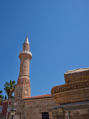 a historical mosque minaret and blue sky