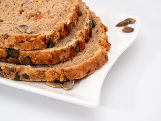 bread with pumpkin seeds on a white background.