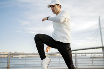 Man sports training fitness on the street in sportswear