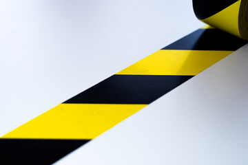 Yellow construction tape on a white background.Reconstruction of the object. The announcement of...