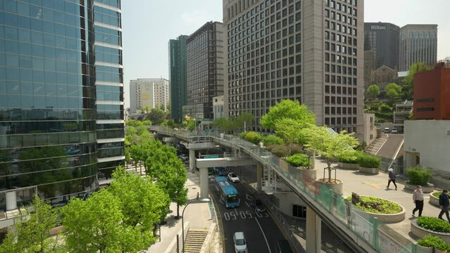Seoul city - Seoullo 7017 skygarden park and cars traffic under the overpass - elevated view
