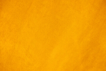 Yellow velvet fabric texture used as background. Empty yellow fabric background of soft and smooth textile material. There is space for text.