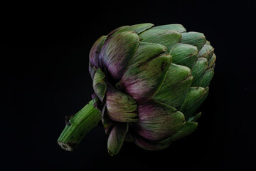 An isolated artichoke on black background