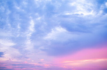 beautiful soft orange clouds  and sunlight on the blue sky perfect for the background, take in morning,Twilight, sky  gradient background,purple sky
