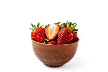 Fresh strawberries in a brown bowl on white background