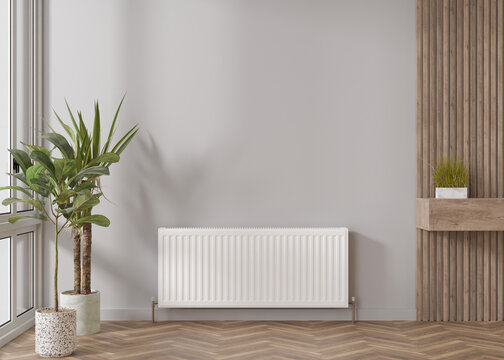 White heating radiator on grey wall in modern room. Central heating system. Free, copy space for your text. 3D rendering.