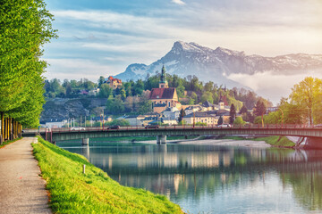 Obraz premium Salzburg sunset light and reflection of the city in warm lights. Austria