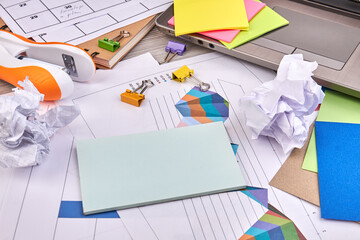 Close-up many office stuff on the desk. Blank note for copy space.