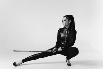 beautiful girl with a katana in a tight latex suit © Alex Barera