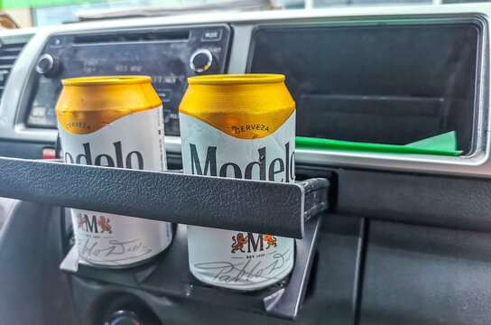 Modelo beer can in the car Playa del Carmen Mexico.