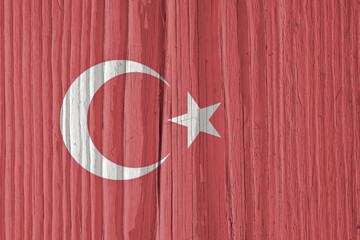 Turkish Flag on a dry wooden surface. Natural background or backdrop made of old wood. The official...