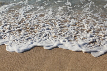 waves on the sand at south sumbawa beach