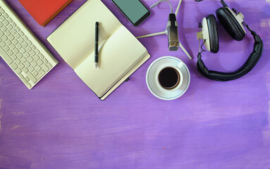 Producing podcast with stylish headphones,vintage microphone,coffee,smartphone,computer keyboard on...