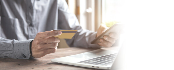 Businessman use credit card to spend money or pay for goods and online services.