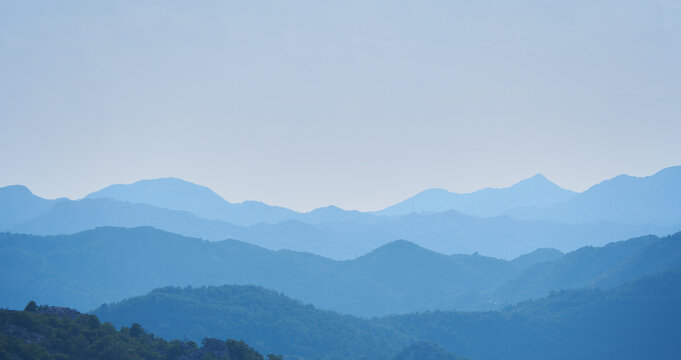 Mountain landscape with layers effects in blue haze