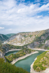 Fototapeta premium Meanders at rocky river Uvac gorge on sunny day, southwest Serbia.