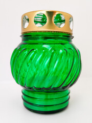 An unquenchable lamp made of green glass. Candle for the grave with a lid. A memorial candle. A memory candle.