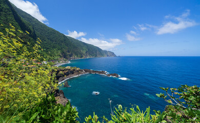 Praia da laje (praia da Jamaica ) beach with black sand, Seixal coast, Madeira island