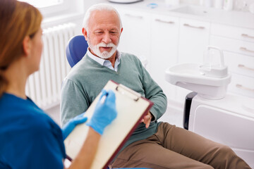 Senior man having dental checkup at dentist office - obrazy, fototapety, plakaty