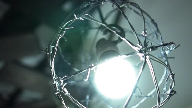 Punk style lamp made of barbed wire