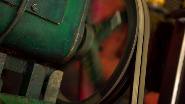 old pump with its rotating belt