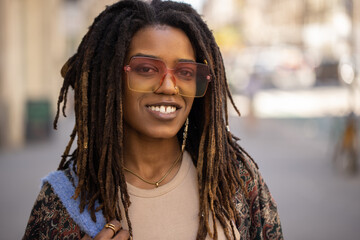 Young black woman in city portrait smiling happy face