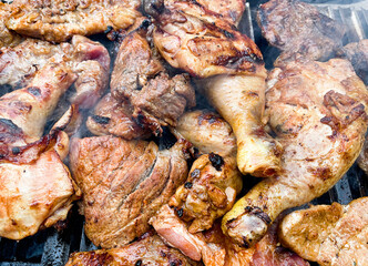 Marinated meat on charcoal grill bbq grilling chicken and pork