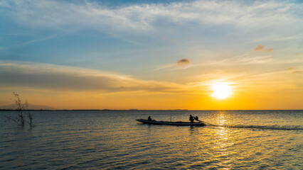 Fishing boat at sunset in the evening