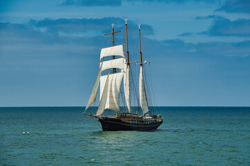 Old sailing ship under sail on the sea