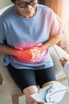Abdominal pain in elder senior mature aging woman with stomachache illness from stomach cancer, irritable bowel syndrome, Indigestion, Diarrhea or GERD (gastro-esophageal reflux disease)
