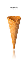 An empty waffle cone is isolated on a white background. Side view, vertical.